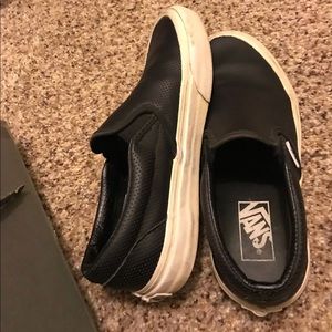 vans black perforated classic slip on